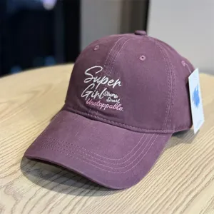 Unisex purple baseball cap with stylish embroidered letter design, soft top and wide brim.