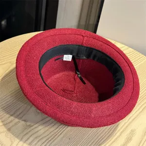 Detailed interior view of the elegant red wool bucket hat, highlighting soft texture.