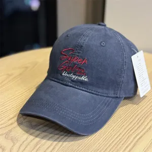 Washed cotton baseball cap with stylish front letter embroidery and soft brim for daily wear.