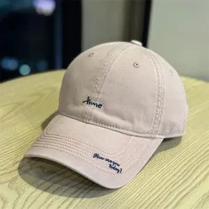 Pink washed cotton baseball cap with letter embroidery, curved brim streetwear sun hat for daily use.