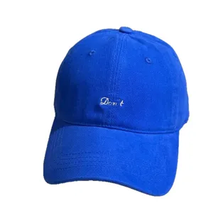 Classic blue dad hat featuring white embroidered text, soft top baseball cap for casual daily wear.