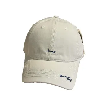 Trendy beige embroidered baseball cap with letter design, stylish sun protection curved brim.