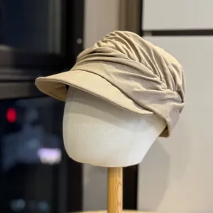 Details of beige pleated newsboy hat, stylish Japanese dark style soft fabric cap with visor.