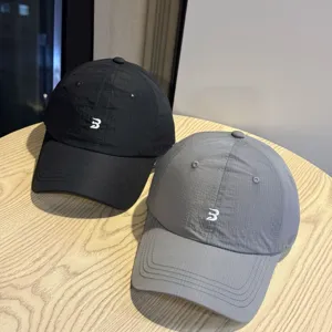 Korean style lightweight breathable quick-dry baseball cap in black and gray for women.