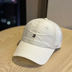 Minimalist white lightweight breathable quick-drying baseball cap with embroidered logo.