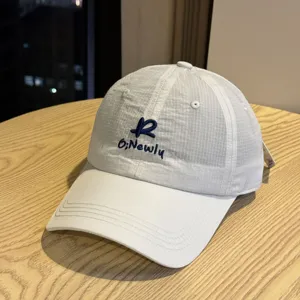 White quick-dry baseball cap with blue embroidery, stylish casual duckbill sun hat for daily wear.