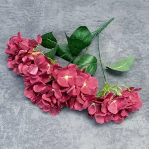 Detailed close-up of 5-head artificial hydrangea flower showing realistic petals and green leaves.