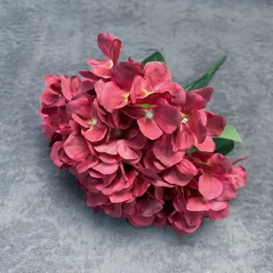 Detail shot of artificial red hydrangea flower bunch for wedding decor and floral designs.