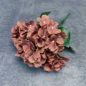 Detail view of 5-head artificial hydrangea flower, featuring retro brown petals and green leaves.