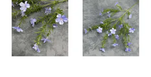 Detalle de ramas de flores azules artificiales, ideal para decoración del hogar y bodas.