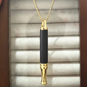 Close-up of wooden meditation breathing whistle pendant necklace, exquisite details.