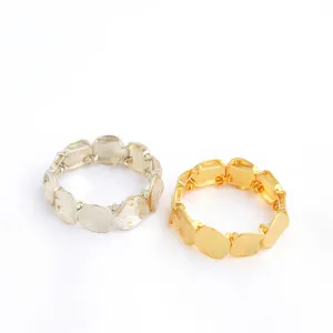 Close-up view of minimalist geometric metal disc link bracelet set, showing unique chunky style detail.