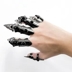 Details of gothic punk metal finger armor rings, adjustable mechanical claw rings for dark style fashion.