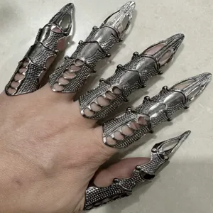 Detail view of gothic cyberpunk adjustable mechanical finger armor rings, cool robotic claw design.