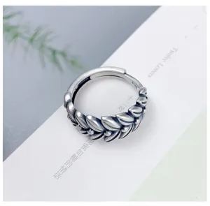 Detailed view of vintage wheat leaf silver adjustable open ring, classic retro style jewelry.