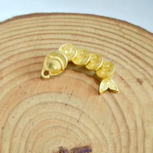 Detailed close-up view of the exquisite gold coin fish pendant showcasing fine traditional craftsmanship.