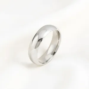Minimalist smooth metal ring detail shot, modern simple polished silver band jewelry.