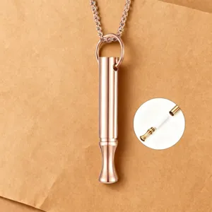 Rose gold stainless steel mindfulness breathing whistle pendant necklace for anxiety relief.