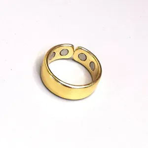 Golden magnetic therapy open ring adjustable health ring, fine metal detail showcase.