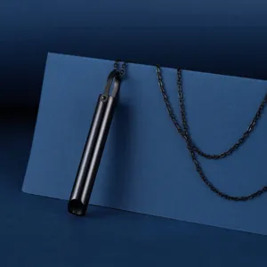 Close-up of black stainless steel breathing necklace for meditation and mindfulness stress relief.