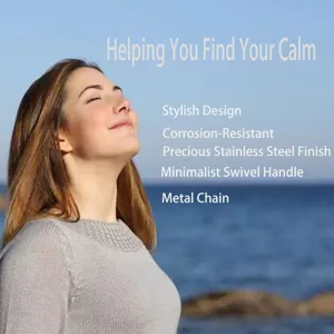 Stainless steel breathing meditation necklace pendant with minimalist swivel handle and metal chain.
