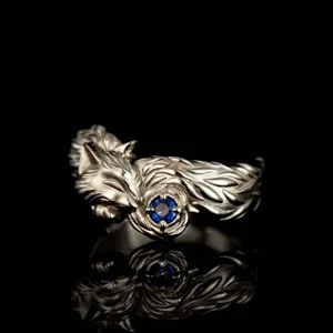 Vintage zilveren vos ring met blauwe saffier edelsteen, gedetailleerd dier sieraden ontwerp.