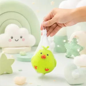 Cute green chick squeeze toy in white mesh bag, sweet pastel main product studio photo