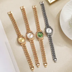 Reloj de cuarzo para mujer de acero dorado con bisel de estrás reloj de lujo para el trabajo.
