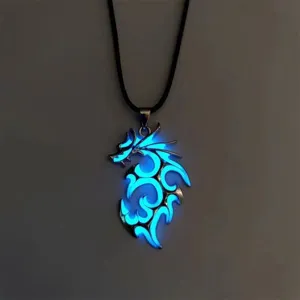 Close-up detail shot of the glowing dragon pendant necklace showing luminous blue light.