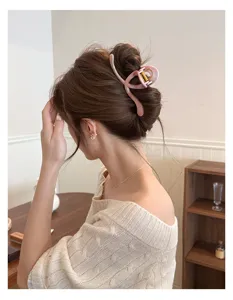 Peach pink crescent hair claw clip, marbled hollow updo shark clip for sweet women hair styling.