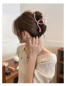 Pink marbled crescent hair claw clip for women, elegant hollow updo hair accessory style.