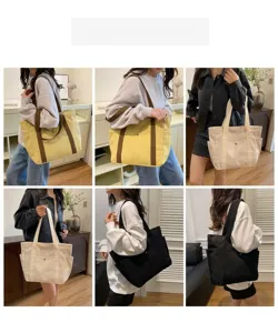 Detailansicht der großen Canvas Shopper Tasche mit Schulterriemen und praktischen Seitentaschen.