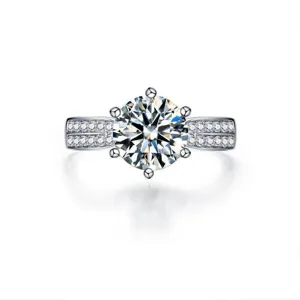 Elegant silver moissanite ring featuring a stunning six-prong center stone and pavé band.