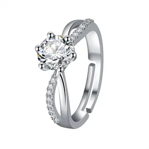 Stunning 1-carat moissanite six-prong diamond ring with sparkling cross-over band.