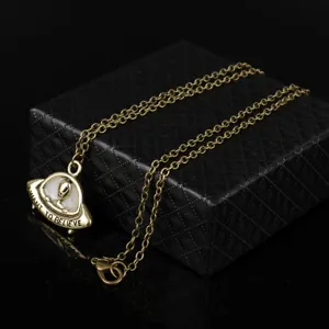 Vintage UFO alien pendant necklace with luminous design, ideal fashion gift for sci-fi fans.
