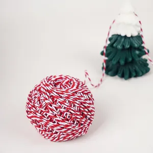 Red and white baker's twine cotton string for gift wrapping packaging and DIY craft projects.