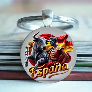 Closeup detail view of the Spanish bullfighter design glass cabochon metal keyring pendant.