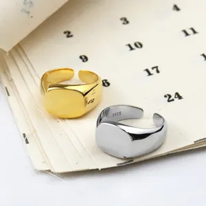 Minimalist geometric square open rings in gold and silver, elegant metal signet fashion jewelry.