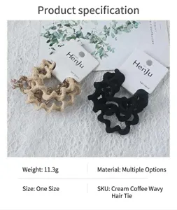 Detailed view of wavy hair bands in khaki and black, stylish everyday hair accessories.