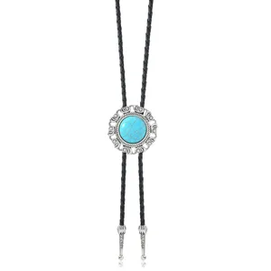 Gedetailleerde close-up van de vintage turquoise bolo stropdas met gevlochten leren koord en metaal.