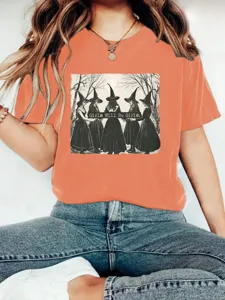 Orange vintage witch graphic crewneck short sleeve t-shirt, casual summer streetwear tee.