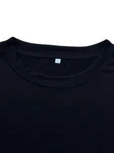 Close-up of black crew neck short sleeve t-shirt neckline with XL size label detail.