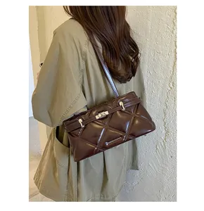 Chic quilted underarm shoulder bag for women, stylish lock closure, soft PU leather commuter purse.