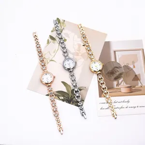 Close-up detail of stylish women rhinestone quartz wristwatches in rose gold, silver, and gold.
