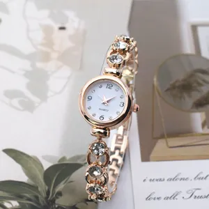 Exquisite women's quartz bracelet watch with rose gold finish and sparkling rhinestone details.