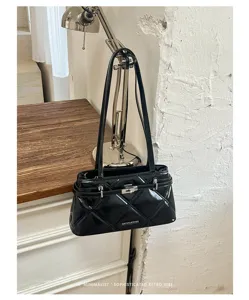 Black patent leather quilted shoulder bag detail, featuring metallic turn-lock and chic retro vibe.
