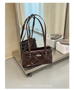 Chic brown quilted shoulder bag with metal lock, minimalist retro design for women's daily commute.