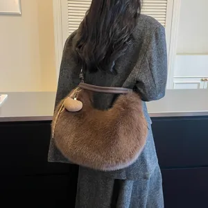 Brown fluffy shoulder bag for women, winter plush underarm hobo bag with cute woven charm.