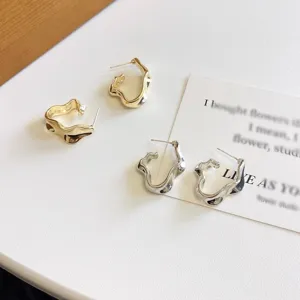 Chic irregular metallic folded hoop earrings, minimalist niche design for women and girls.
