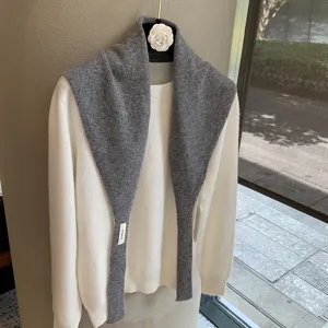 Soft knitted draped small shawl and white sweater set, elegant autumn layering fashion piece.